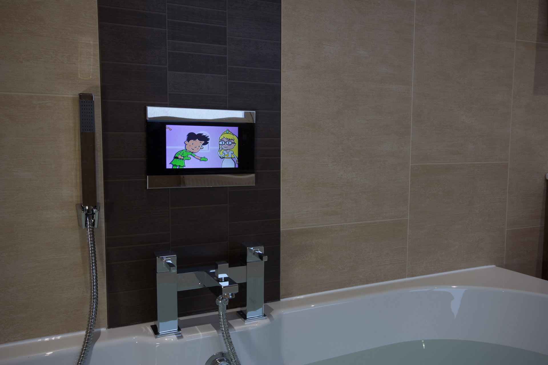 Beautiful wide angle establishing photo showing a newly rennovated bathroom bath, shower, sink and PVC wall panels